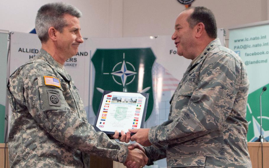 Lt. Gen. John W. Nicholson, commander of the NATO Allied Land Command, officially reports to NATO Supreme Allied Commander Europe Gen. Phillip Breedlove that LANDCOM is at fully operational, during a press conference at Grafenwoehr, Germany, Dec. 10, 2014.