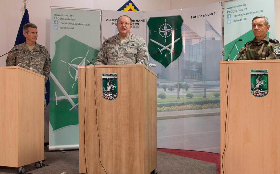 Gen. Phillip Breedlove, NATO Supreme Allied Commander Europe, speaks to senior military leaders from across NATO about the impact of Trident Lance 2014, during a press conference at Grafenwoehr, Germany, Dec. 10, 2014. Lt. Gen. John W. Nicholson, commander of the NATO Allied Land Command and French Gen. Jean-Paul Palom?ros, the NATO Supreme Allied Commander Transformation stand to each side of Breedlove.