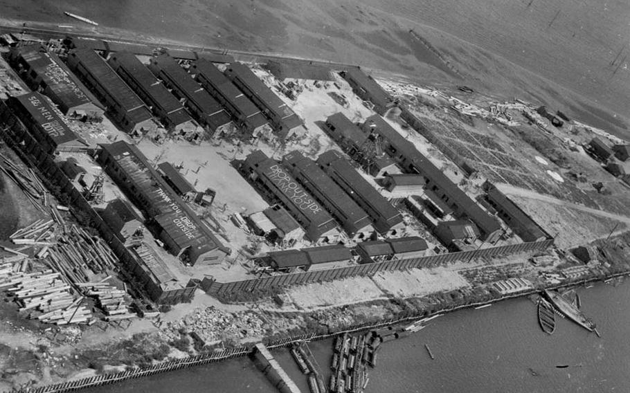 An aerial view of the Omori Prison Camp, located near Tokyo, at the end of the war. Messages from the prisoners can be seen scrawled on the roofs.