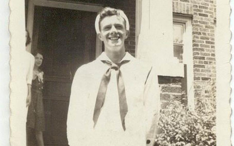 Petty Officer 1st Class Denny Landrum lives on through the flag he made while in Japanese captivity during World War II. The flag, which was used to signal allied aircraft, is on display at the Virginia War Memorial in Richmond. He is seen here in front of his house before shipping out. 