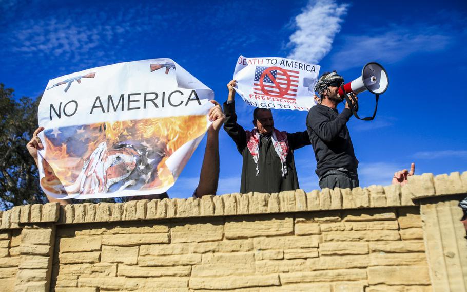 Arabic-speaking role-players simulate a riot outside the gates of a combat simulation town at Camp Pendleton, Calif., Jan. 7, 2015. The role-players dressed for the part and spoke the language to create a cultural and language barrier for Marines of 3rd Battalion, 7th Marine Regiment, 1st Marine Division during a training exercise.