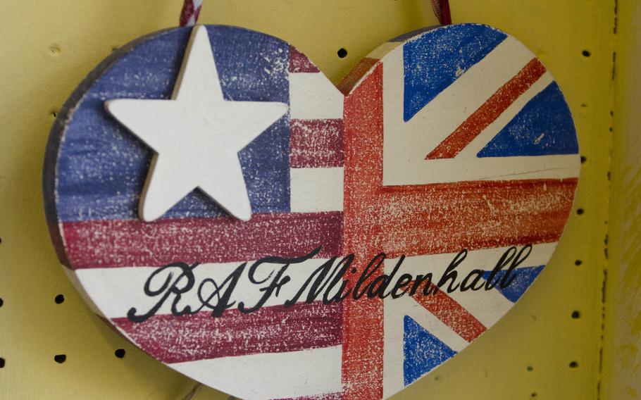 A decorative sign hangs in Bon Ami Cottage Crafts located in the center of Mildenhall, England. Melanie Brooks, who owns the store with her husband, joked these kind of signs will become antiques with the closure of the U.S. air base at RAF Mildenhall. The planned closure was announced on Thursday, Jan. 8, 2015.