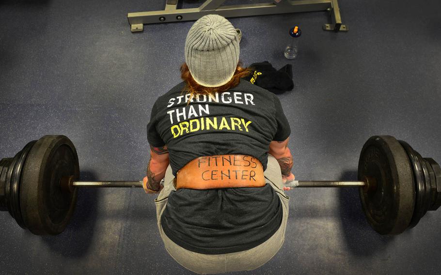 Staff Sgt. Ashley Bryant performs a deadlift, on Tuesday, Jan. 6, 2014, at Aviano Air Base, Italy. While on leave, Bryant broke the women?s national record for bench press and returned to Aviano to break the Dragon Fitness Center?s ?Wall of Fame? record, with a total weight of 235 pounds.