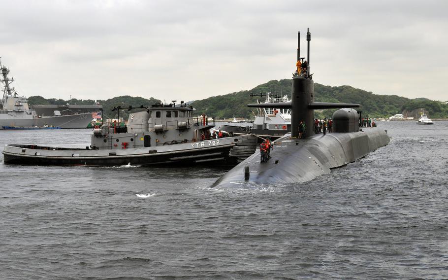 The Ohio-class guided-missile submarine USS Michigan arrives at Fleet Activities Yokosuka, Japan, on June 13, 2012. The Navy announced Wednesday that it was opening billets onboard the Ohio-class sub to enlisted women, with plans of adding them to the boat in 2016.