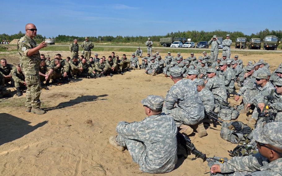 Ukrainian army Maj. Maksym Klunnyk instructs173rd Airborne Brigade soldiers and Ukrainian army cadets during traffic control training at Exercise Rapid Trident near Yavoriv, Ukraine, Wednesday, Sept. 17, 2014. In the spring, U.S. Army Europe will send a team of advisers into western Ukraine to help train troops according to USARUER commander Lt. Gen. Ben Hodges.