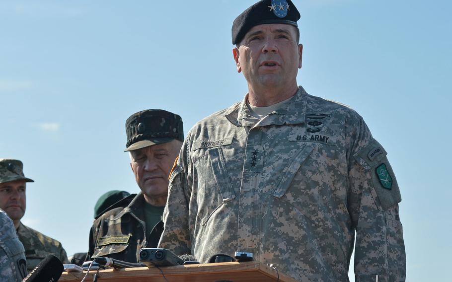 U.S. Army Europe commander Lt. Gen. Ben Hodges, then commander NATO Allied Land Command, talks to the media at Exercise Rapid Trident near Yavoriv, Ukraine, Friday, Sept. 19, 2014. In the spring, USAREUR will send a team of advisers into western Ukraine to help train troops, according to Hodges. Behind Hodges at left is Lt. Gen. Anatoliy Pushniakov, Ukrainian land forces commander.
