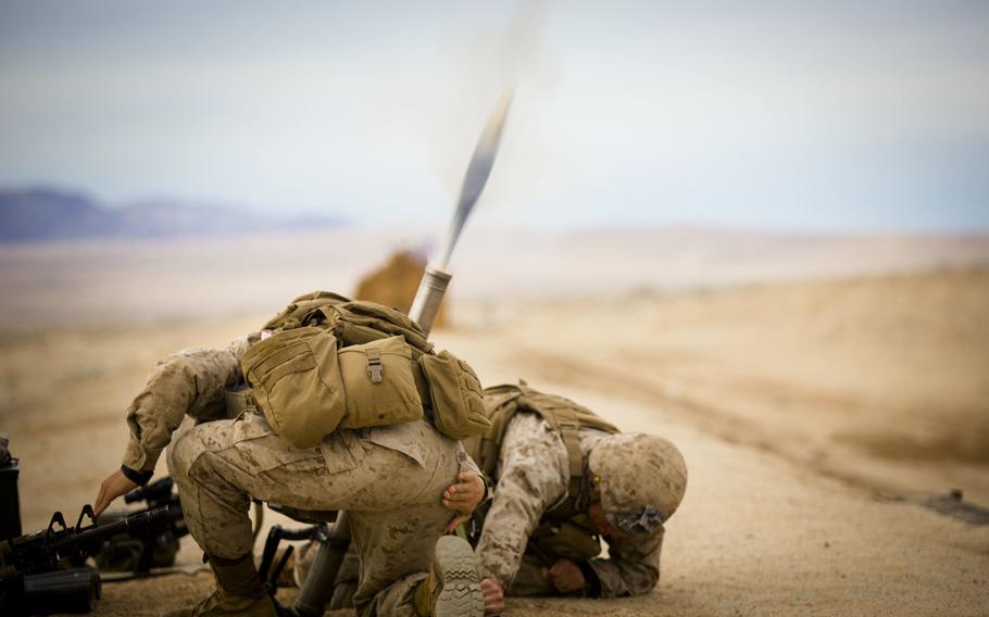 U.S. Marines assigned 2nd Battalion, 3rd Marine Regiment fire the M224 60 mm mortar system at Range 106 aboard Camp Wilson, Marine Corps Air Ground Combat Center Twentynine Palms, Calif., on Jan. 20, 2015.