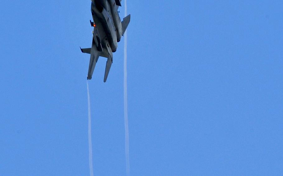 A U.S. Air Force F-15C Eagle from the 44th Fighter Squadron flies over Kadena Air Base, Japan, during a training surge on Jan. 15, 2015.