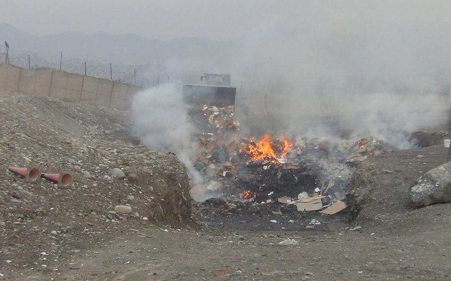 An open-air burn pit at Shindand Airbase.