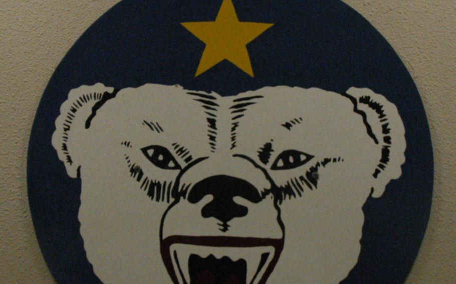 Insignia on a barracks wall at Black Rapids Training Site, Alaska.