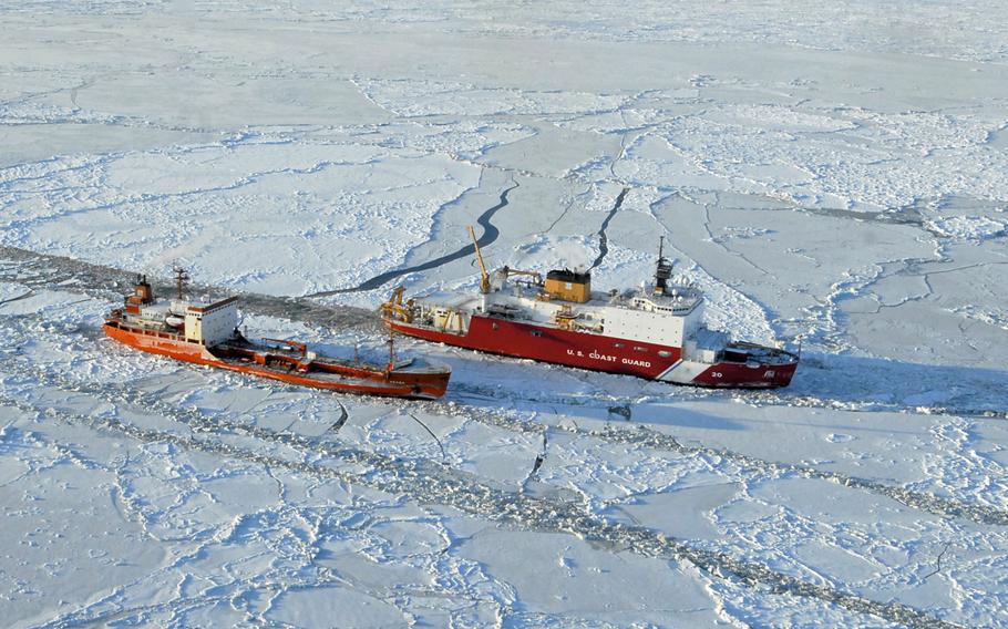 The Coast Guard Cutter Healy breaks ice around the Russian-flagged tanker Renda 250 miles south of Nome, Alaska, on Jan. 6, 2012. The Healy is the U.S. military's only operating polar icebreaker. Russia, on the other hand, has the world's largest fleet of icebreakers, essential to a region rich with natural resources.
