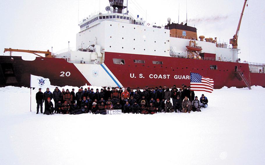 The Coast Guard Cutter Healy's crew poses in front of the cutter after reaching the North Pole on Sept. 6, 2002. The Healy -- the U.S. millitary's only icebreaker -- became only the second U.S. surface ship to reach the North Pole.
