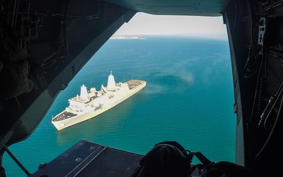 The Mayport, Fla.-based amphibious transport dock ship USS New York positioned off the coast of Kuwait, March 1, 2015. The picture was taken from an MV-22 Osprey shortly after it took off from the ship's flight deck.