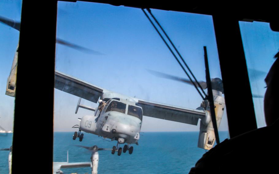 An MV-22 Osprey lands on the flight deck of the amphibious transport dock ship USS New York while it's anchored off the coast of Kuwait, Sunday, March 1, 2015. 