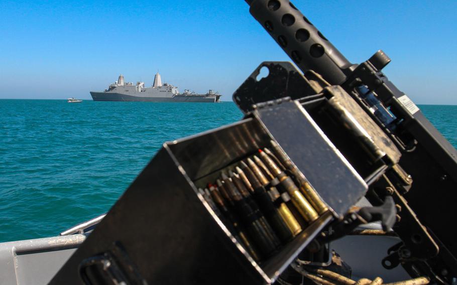 The amphibious transport dock ship USS New York, positioned off the coast of Kuwait, is shown from the vantage point of a U.S. Navy security patrol craft, Feb. 27, 2015.