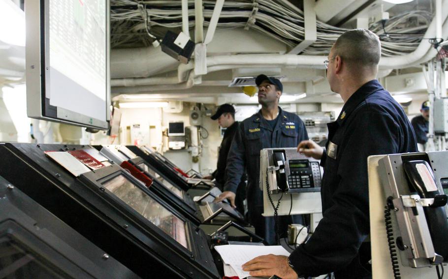 Engineers aboard the amphibious transport dock ship USS New York monitor the consoles in the ship's Central Control Station, Feb 27, 2015. 