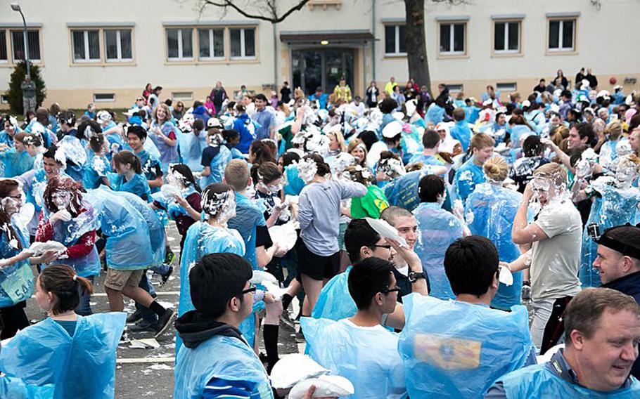 Students make a mess as they throw shaving cream pies during an attempt at breaking the world record for shaving cream pie fights. The Patch High School team, led by the school's math honor society, threw 1,002 pies. If recognized by Guiness World Records, it will set a new record. 
                Courtesy Virginia Kozak