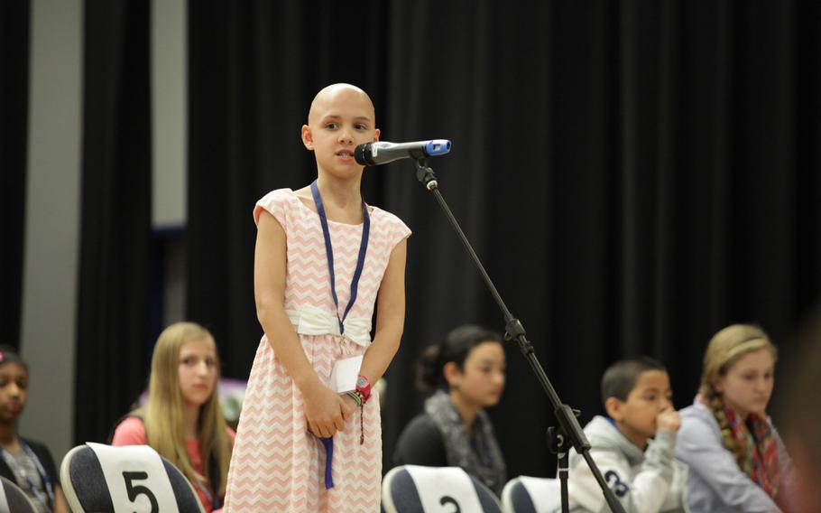 Sigonella Elementary School's Ellen Jackson properly spells a word Saturday, March 21, 2015, at the European PTA Spelling Bee at Ramstein Elementary School in Germany. Jackson, Sigonella's spelling champion, was one of 26 champions from across U.S. schools in Europe who competed for a shot at the Scripps National Spelling Bee in Washington.