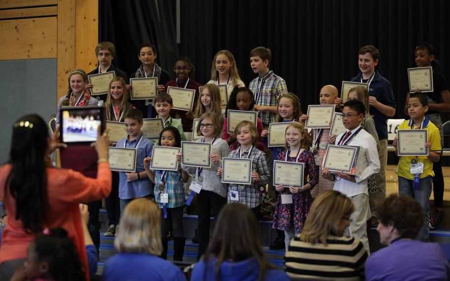 Competitors in the European PTA Spelling Bee pose for photos after the competition Saturday, March 21, 2015, at Ramstein Elementary School in Germany.