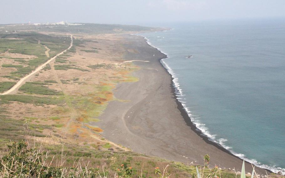 Iwo Jima's black sand beach from the top of Mount Suribachi.
                