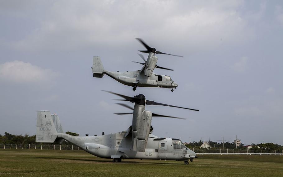 U.S. Marine Corps MV-22 Ospreys with Marine Medium Tiltrotor Squadron 262 (Reinforced), 31st Marine Expeditionary Unit (MEU), take off carrying noncombatant role-players during a Noncombatant Evacuation Operation as part of Certification Exercise, on Camp Hansen, Okinawa, Japan, March 22, 2015.