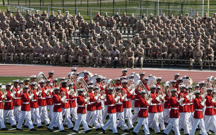 The U.S. Marine Drum and Bugle Corps marches on during a Battle Color Ceremony at Liversedge Field, Camp Lejeune, N.C., on March 24, 2015.