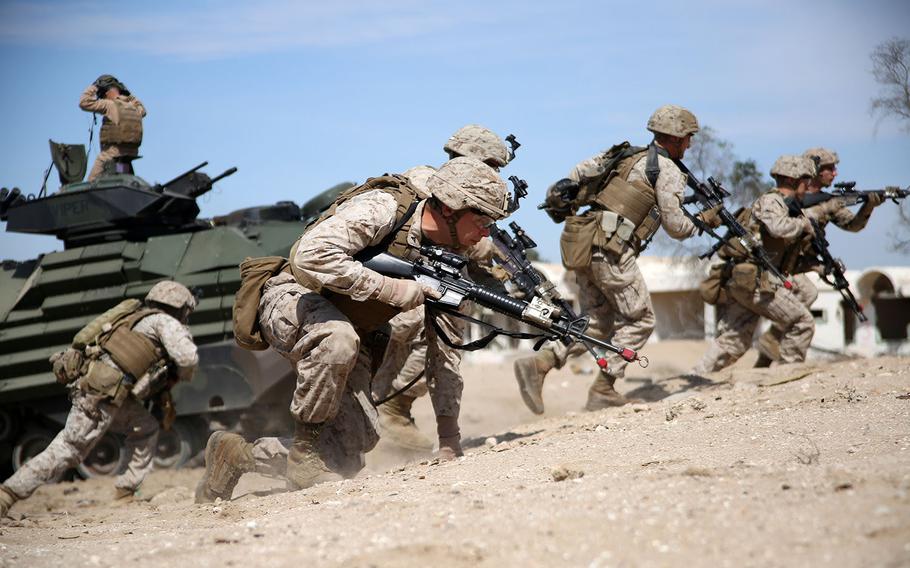 U.S. Marines with the 24th Marine Expeditionary Unit, prepare to assault a simulated objective during Exercise Eagle Resolve 2015 at Failaka Island, Kuwait, March 24, 2015.