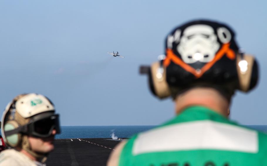 Flight deck crews aboard the USS Carl Vinson in the Persian Gulf launch a U.S. Navy F/A-18 Hornet in support of combat operations against Islamic militants in Iraq and Syria, Nov. 27, 2014. The Carl Vinson Carrier Strike Group has departed the Middle East after six months supporting combat operations in Iraq and Syria.