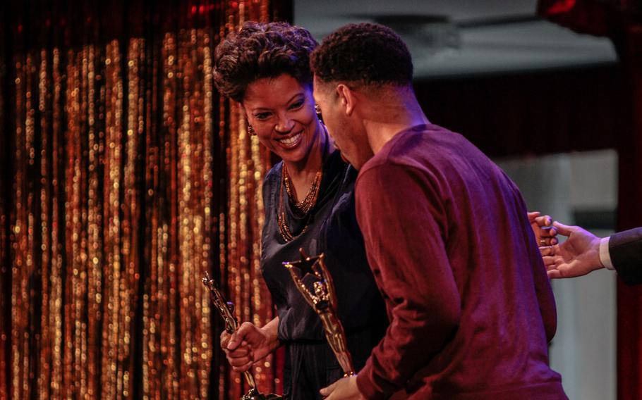 Tonya Holloway and Christopher Mazen walk off stage after picking up their Special Judges' Choice Awards Saturday, April 25, 2015, for their original music on Stuttgart Theater Center's production of ''Her Stories.''