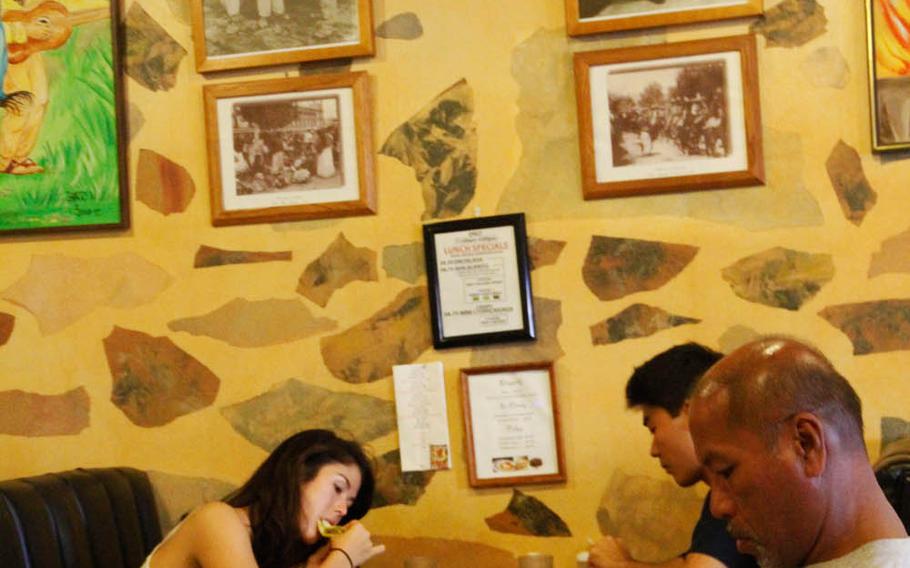Famous -- and infamous -- figures from Mexican history loom above diners at Azteca Mexican Restaurant in Honolulu.