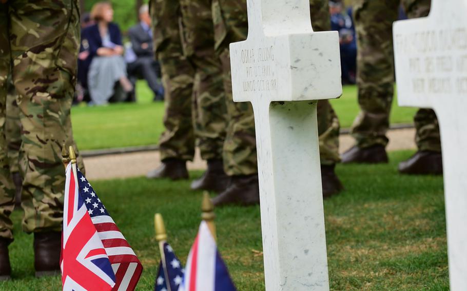 Members of the British Army Training Cerntre, Pirbright, stand in formation alongside rows of headstones on the grounds of Brookwood American Military Cemetery during a Memorial Day Ceremony at Brookwood Military Cemetery, United Kingdom, on May 24, 2015. The cemetery is the final resting place of 468 American servicemembers who lost their lives during World War I.