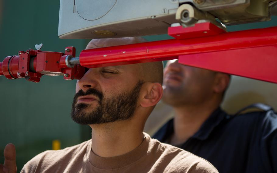 Czech Air Force Ensign Peter Krajcovic tests a prototype bore-sight rack adapter on an Afghan air force Mi-17 helicopter at Hamid Karzai International Airport, Afghanistan, on May 18, 2015. The bore-sight rack adapter will be used by the AAF Special Mission Wing in order to accurately be able to sight their weapons system on their Mi-17 version 5 helicopters.