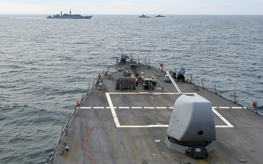 The USS Ross approaches Romanian navy ships in preparation for a passing exercise in the Black Sea, May 26, 2015. The Navy released two videos that it says show Russian jets flying by American and Ukrainian warships in the Black Sea in recent days.