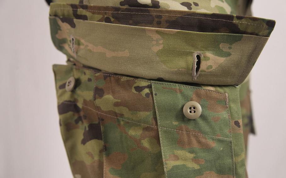 The cord and barrel lock has been removed from the cargo pockets on the leg.