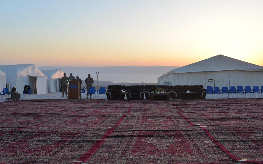 A dance floor of carpets awaits the night's festivities at Camp Titin, Jordan, as the sun sets over the nearby Red Sea on May 16, 2015. Jordanian armed forces hosted the banquet for their Marine counterparts as the annual exercise Eager Lion neared an end.