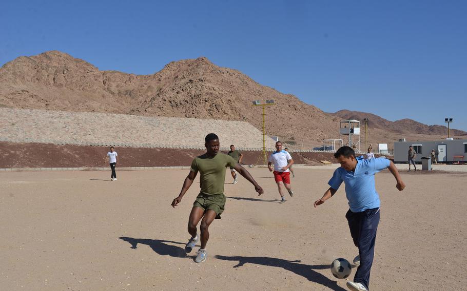 Marine Cpl. Fritz Vieux squares up with a member of the Jordanian armed forces during a soccer match at Camp Titin, Jordan, on May 15, 2015, one of the events surrounding the annual Eager Lion exercise.