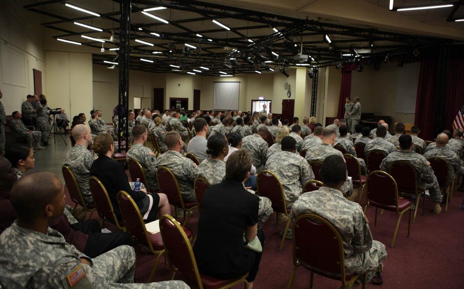 Soldiers of the Army's 7th Civil Support Command attend a town hall meeting Tuesday, June 2, 2015, with Lt. Gen. Jeffrey W. Talley, left, the Chief of Army Reserve and commanding general of U.S. Army Reserve Command, and Command Sgt. Maj. Luther Thomas Jr., his senior enlisted adviser, in Kaiserslautern, Germany.