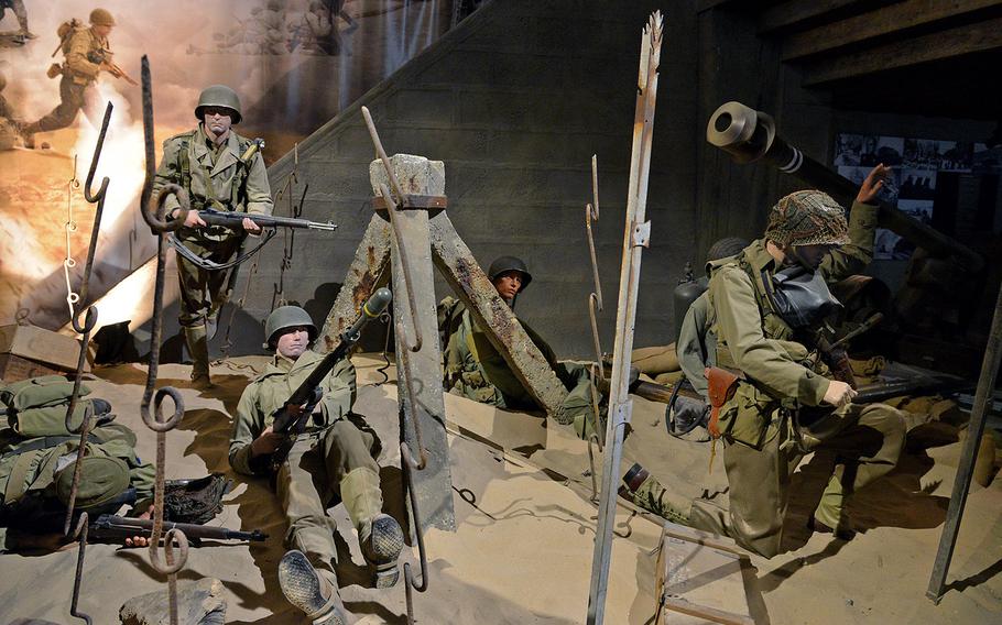 61p bs Michael Abrams/Stars and Stripes A display at at the Overlord Museum in Colleville-sur-Mer, France, depicts American soldiers on D-Day at Omaha Beach.