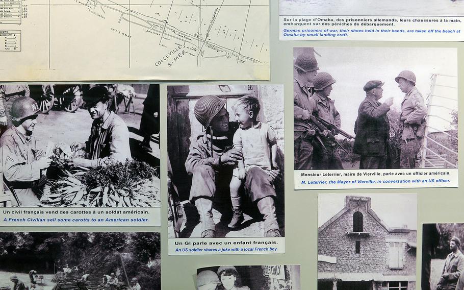 Photos of American soldiers interacting with the locals are on display at the Omaha Beach Memorial Museum in Saint-Laurent-sur-Mer, France. 