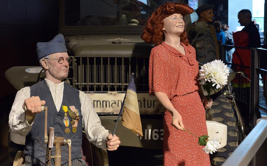 French civilians greet American soldiers in one of the displays at the Overlord Museum.