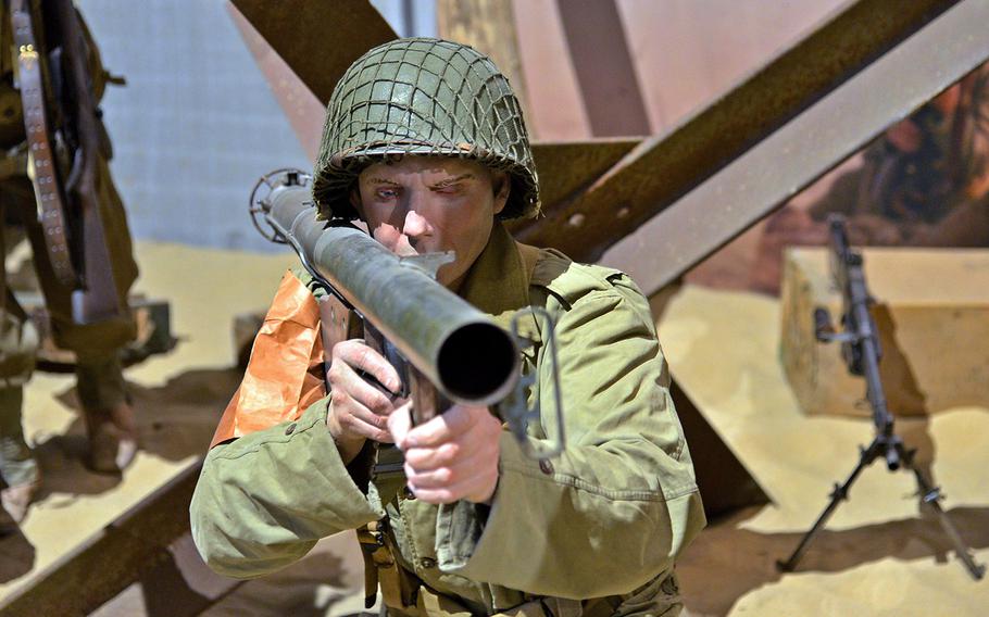 A mannequin dressed as an American soldier aims a bazooka in a display at the Overlord Museum in Colleville-sur-Mer, France.