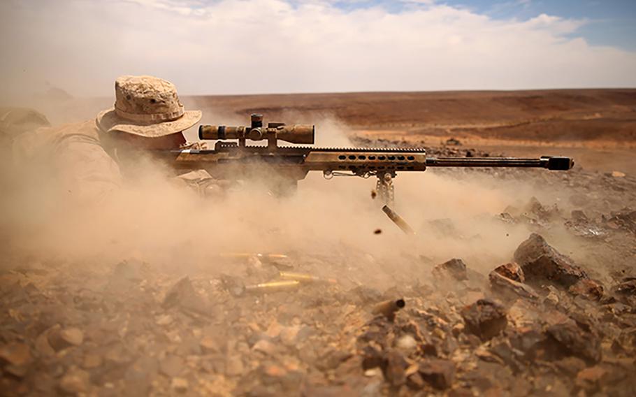 Cpl. Drew Eyre, a scout sniper with the 24th Marine Expeditionary Unit, fires an M107 Special Application Scope Rifle during a bilateral live-fire exercise with the Jordanian armed forces during Exercise Eager Lion 2015 in Jordan, May 7, 2015.