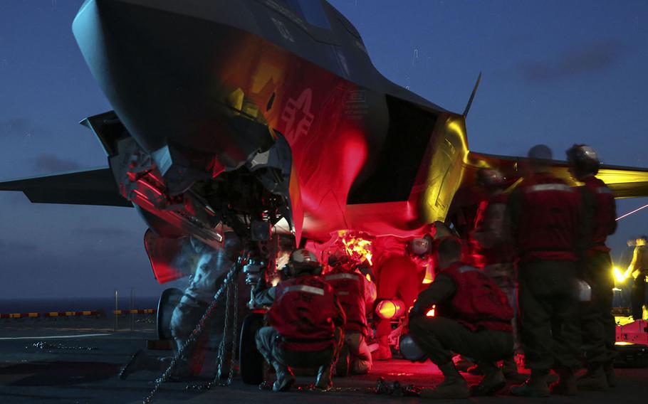 Marines load ordnance onto an F-35B Lightning II during Operational Testing 1 aboard USS Wasp at sea, on May 27, 2015.