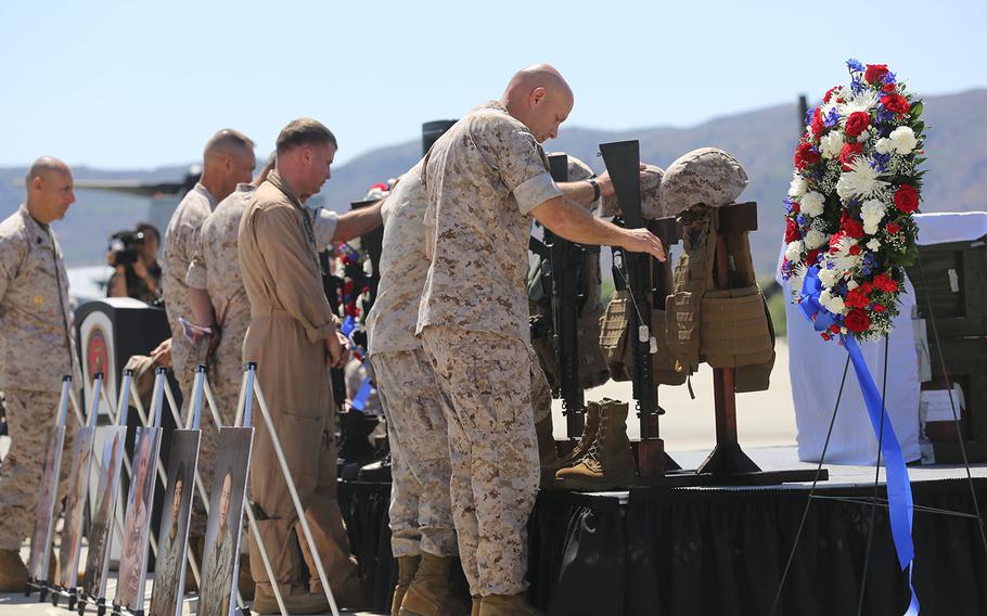 Servicemembers pay respects to fallen Marines at a memorial service June 3, 2015, at Camp Pendleton, Calif. The ceremony honored 6 Marines killed in a UH-1Y helicopter crash while conducting relief efforts in Nepal.
