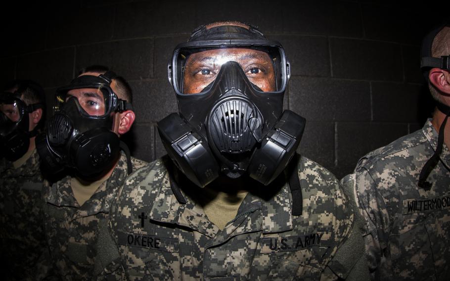 Officers in the Chaplain's Basic Officer Leaders Course put their faith in their protective gear to the test in the chemical, biological, radiological and nuclear warfare chamber.