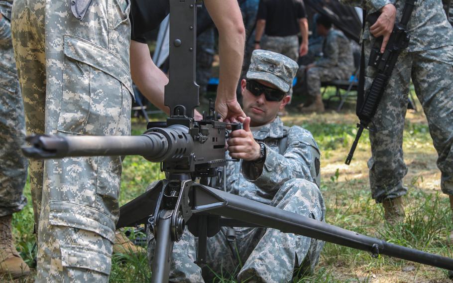 A 2nd Squadron, 6th Cavalry Regiment, 2nd Combat Aviation Brigade soldier learns about a .50-caliber machine gun May 29 at the chemical, biological, radiological and nuclear warfare range near Camp Humphreys, South Korea, on May 29, 2015.