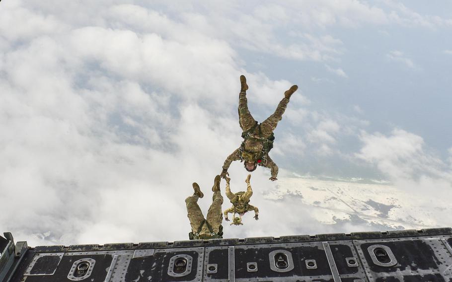 Members of the 7th Special Forces Group perform a high-altitude, low-opening jump from an MC-130P Combat Shadow over Hurlburt Field, Fla., May 15, 2015.