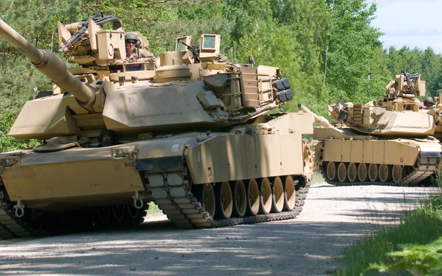 A convoy of M1A1 Abrams Main Battle Tanks with Team Eagle, Task Force 2-7 Infantry in Rukla, Lithuania, stops to search for mock enemy troops during exercise Saber Strike, near Rukla June 9, 2015. Saber Strike is a long-standing U.S. Army Europe-led cooperative training exercise.