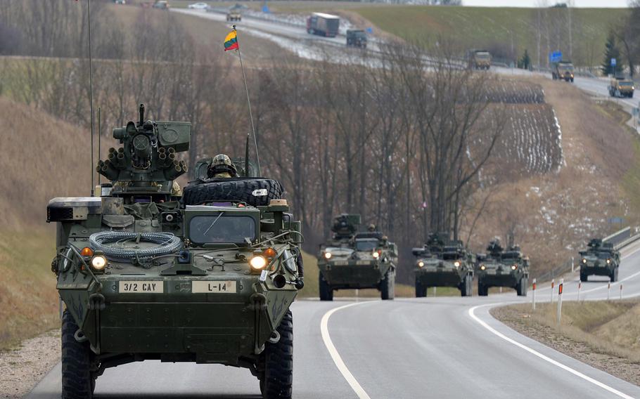 Strykers of Lightning Troop, 3rd Squadron, 2nd Cavalry Regiment travel through Lithuania, Monday, March 23, 2015.