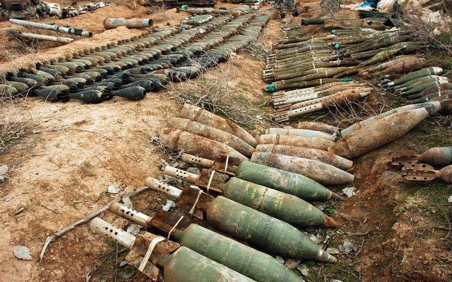 This combat camera photo shows mortar rounds and other ordnance found during an Iraqi army-led patrol of a village and surrounding areas near Hawija, Iraq, Feb. 20, 2006.
                
